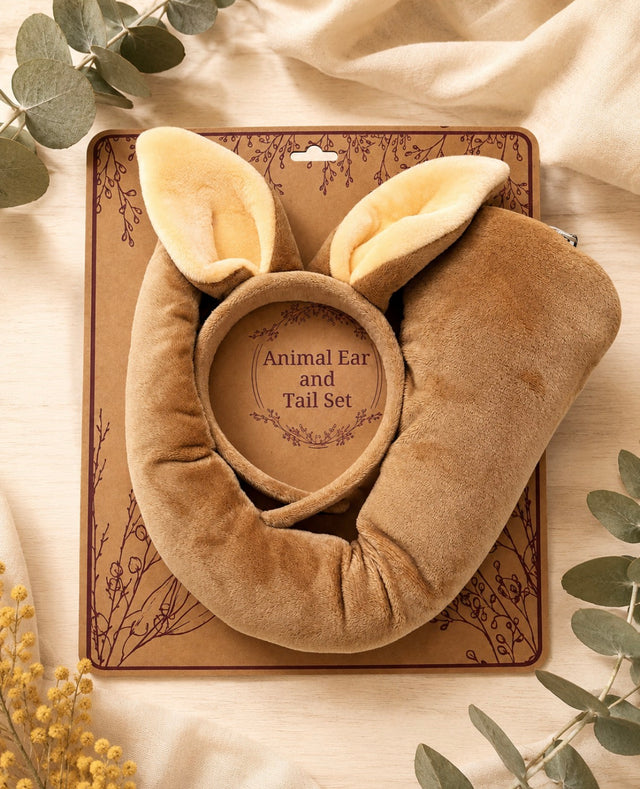 Kangaroo ears headband and tail set styled with wattle and eucalyptus on pale timber