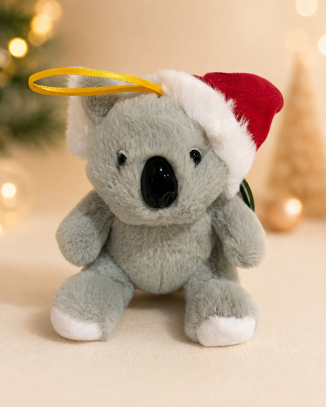 Grey koala plush in a Santa hat with a yellow ribbon hanging loop
